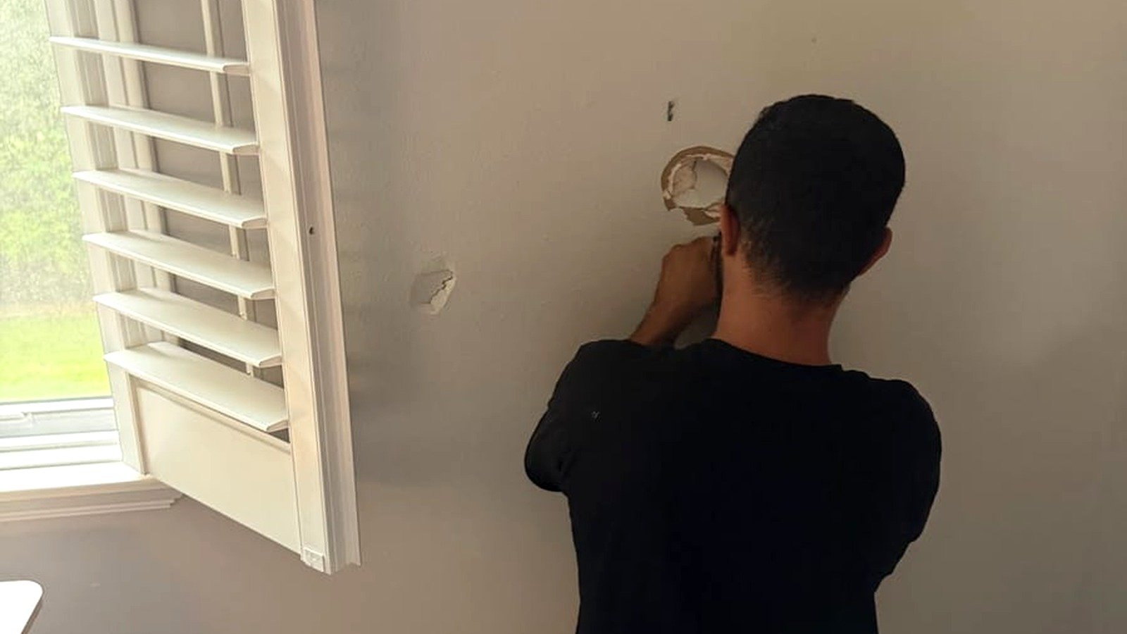 Before drywall repair — damaged interior wall in a Tampa home