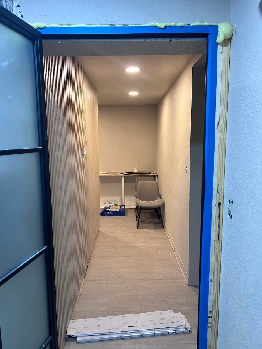 Gray LVP flooring installed by a licensed handyman in a Tampa home office