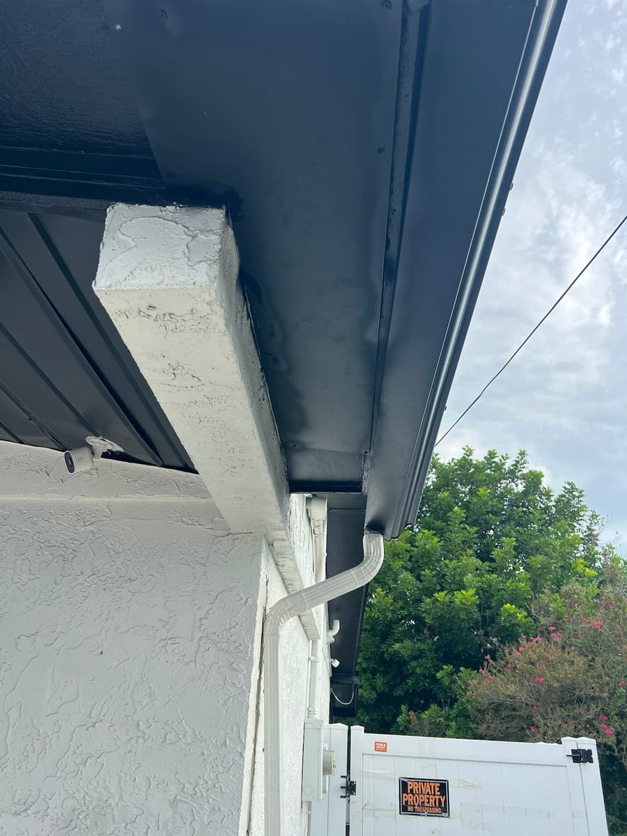 Gutter downspout and soffit line on a Tampa Bay home after a licensed handyman visit