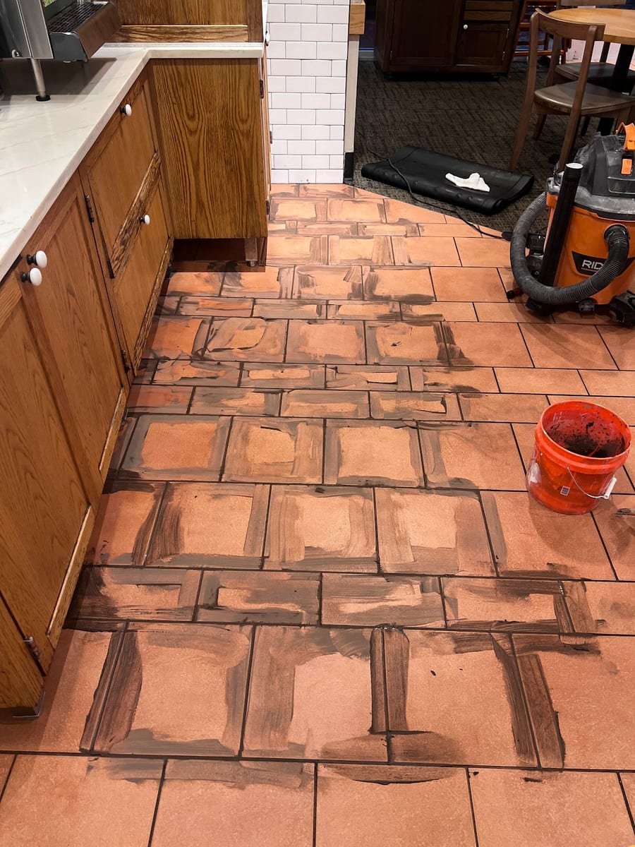 Floor tile grouting in progress on a Tampa Bay job