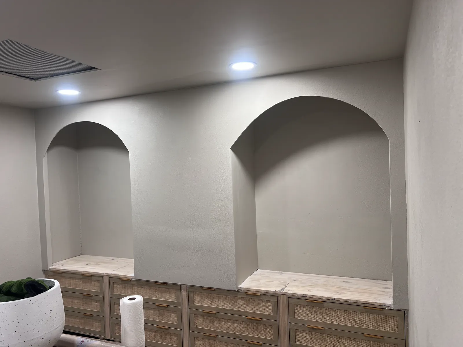 Finished built-in wall niches above drawer cabinets with recessed ceiling lights, Handyman Pros Florida