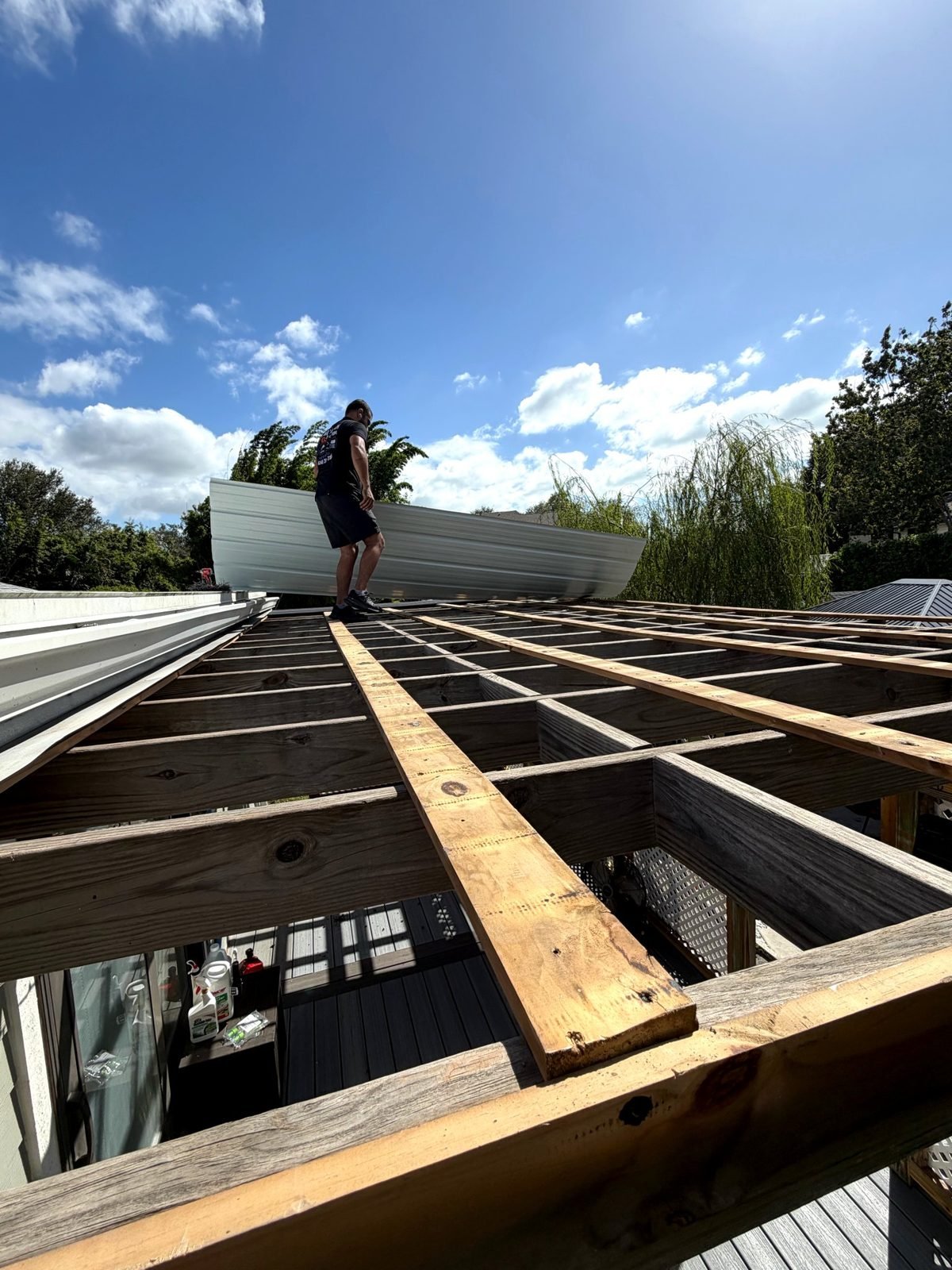 New wood rafter framing for a patio roof built by Handyman Pros FL crew in Tampa, FL