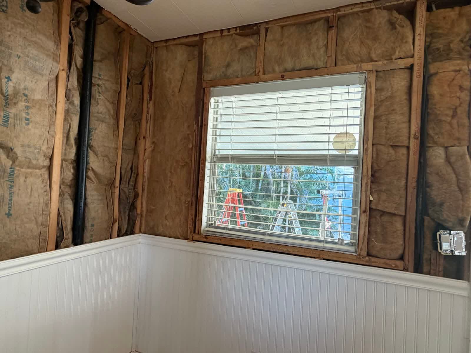 Interior insulation and wainscoting work in a Tampa home