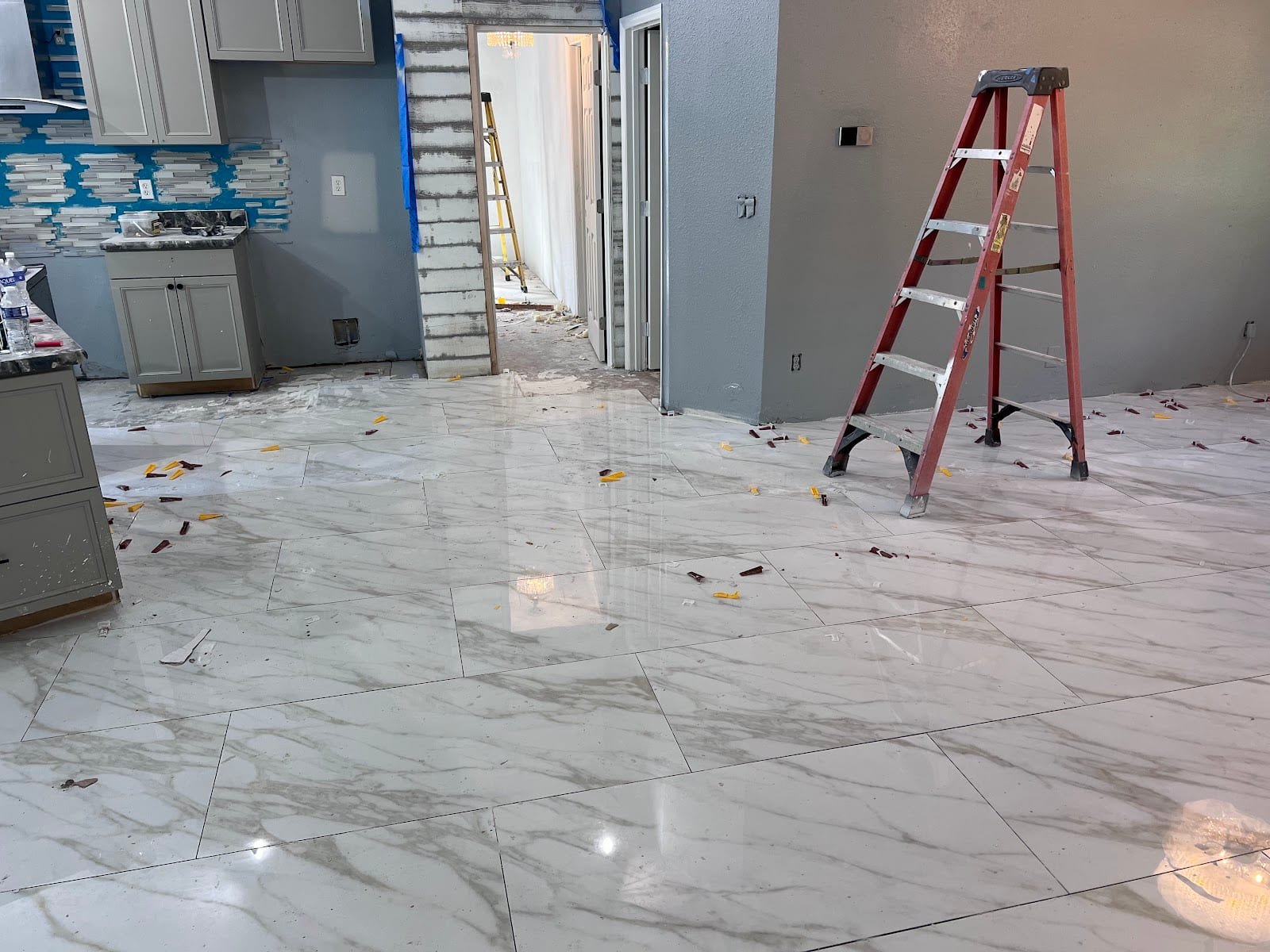 Large-format porcelain floor tile installation in a Tampa kitchen